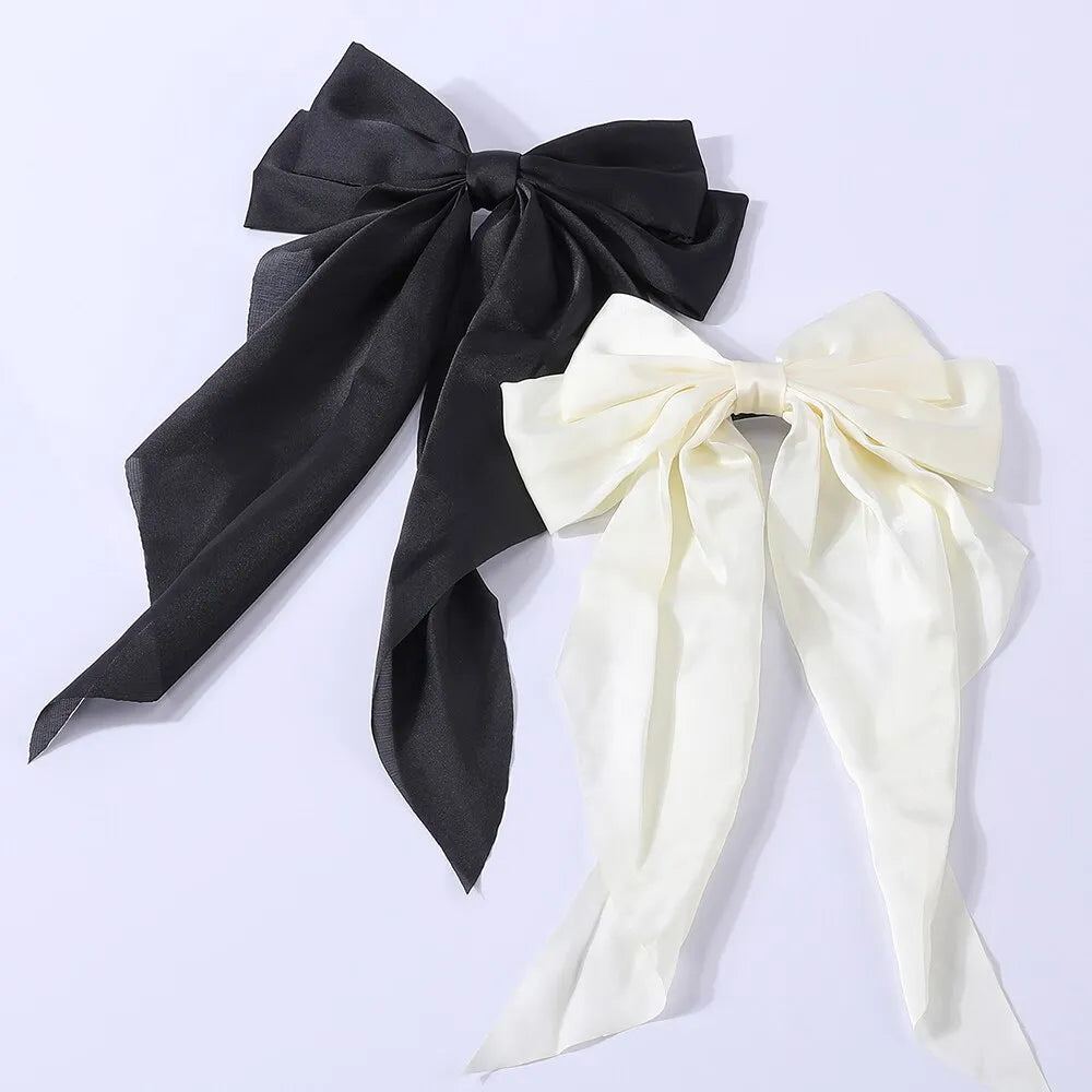 Chic Ribbon Elegance: 2-Piece Satin Bow Hair Clip Set. Hair accessories in USA. Bride accessories in USA. Bridal hair accessories in USA. Kids hair accessories in USA. Girls hair accessories. Hair products. Beautiful hair accessories.