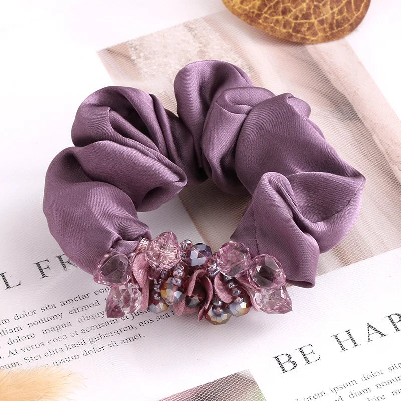 Dazzling Petal Elegance: Crystal-Embellished Floral Fabric Scrunchies. Hair accessories for brides.. Hair accessories in USA. Bride accessories in USA. Bridal hair accessories in USA. Kids hair accessories in USA. Girls hair accessories. Hair products. Beautiful hair accessories.