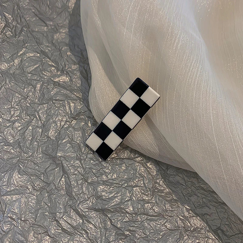 Monochrome Elegance: Retro Grid Acrylic Side Clip. Hair accessories for brides. Hair accessories in USA. Bride accessories in USA. Bridal hair accessories in USA. Kids hair accessories in USA. Girls hair accessories. Hair products. Beautiful hair accessories.