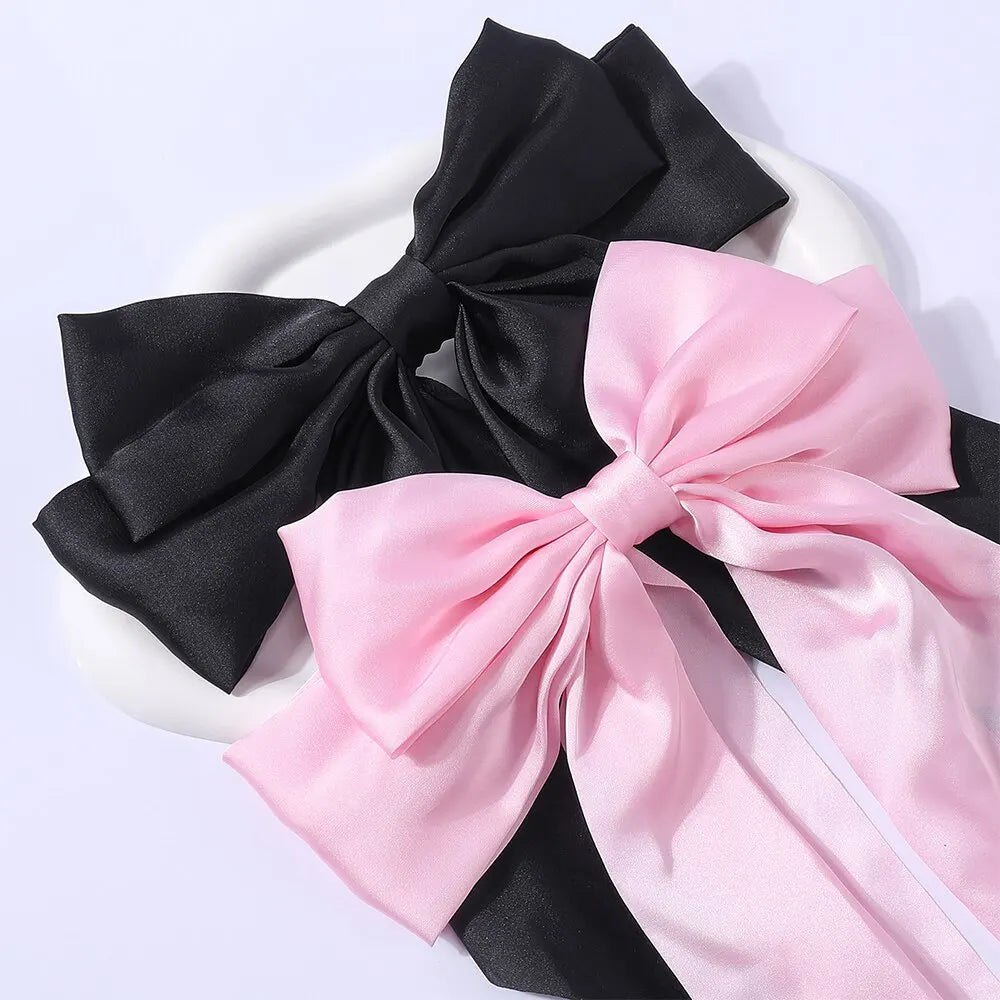 Chic Ribbon Elegance: 2-Piece Satin Bow Hair Clip Set. Hair accessories in USA. Bride accessories in USA. Bridal hair accessories in USA. Kids hair accessories in USA. Girls hair accessories. Hair products. Beautiful hair accessories.