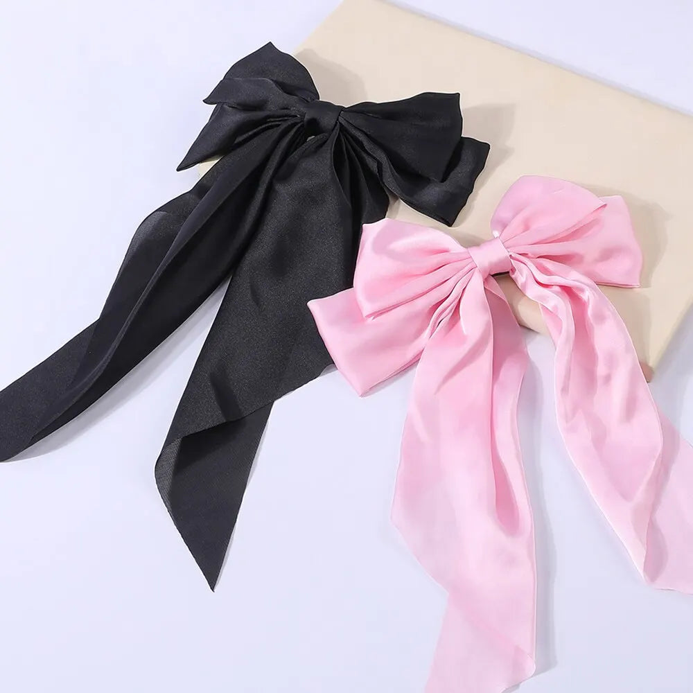 Chic Ribbon Elegance: 2-Piece Satin Bow Hair Clip Set. Hair accessories in USA. Bride accessories in USA. Bridal hair accessories in USA. Kids hair accessories in USA. Girls hair accessories. Hair products. Beautiful hair accessories.