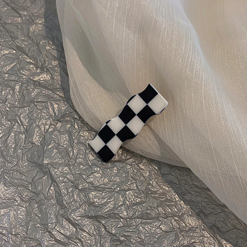 Monochrome Elegance: Retro Grid Acrylic Side Clip. Hair accessories for brides. Hair accessories in USA. Bride accessories in USA. Bridal hair accessories in USA. Kids hair accessories in USA. Girls hair accessories. Hair products. Beautiful hair accessories.