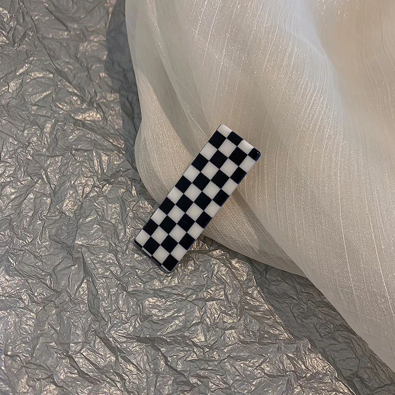 Monochrome Elegance: Retro Grid Acrylic Side Clip. Hair accessories for brides. Hair accessories in USA. Bride accessories in USA. Bridal hair accessories in USA. Kids hair accessories in USA. Girls hair accessories. Hair products. Beautiful hair accessories.