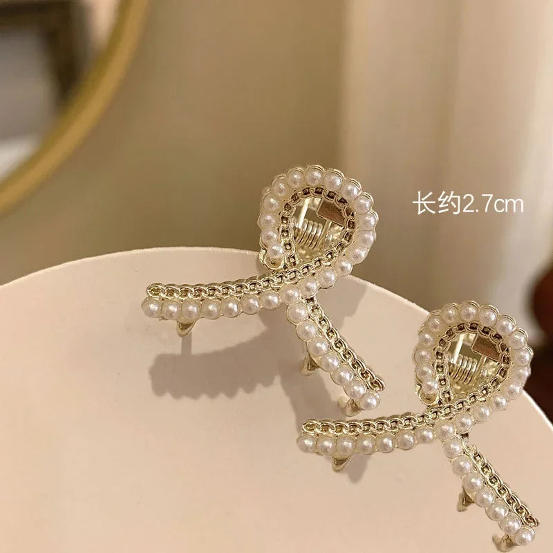 PearlRadiance Duo: Metal Elegance Hair Clips. Hairxza Hair Accessories. Hair accessories in USA. Bride accessories in USA. Bridal hair accessories in USA. Kids hair accessories in USA. Girls hair accessories. Hair products. Beautiful hair accessories.