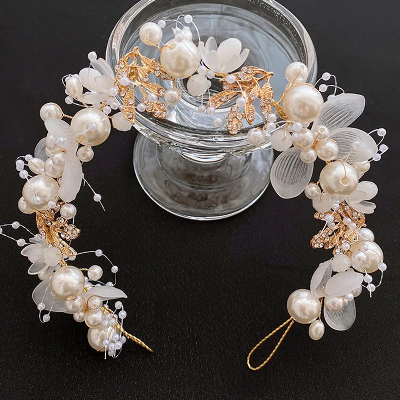 Pearl Petal Radiance: Elegant Floral Bridal Headband. Hairxza Hair Accessories. Hair accessories in USA. Bride accessories in USA. Bridal hair accessories in USA. Kids hair accessories in USA. Girls hair accessories. Hair products. Beautiful hair accessories