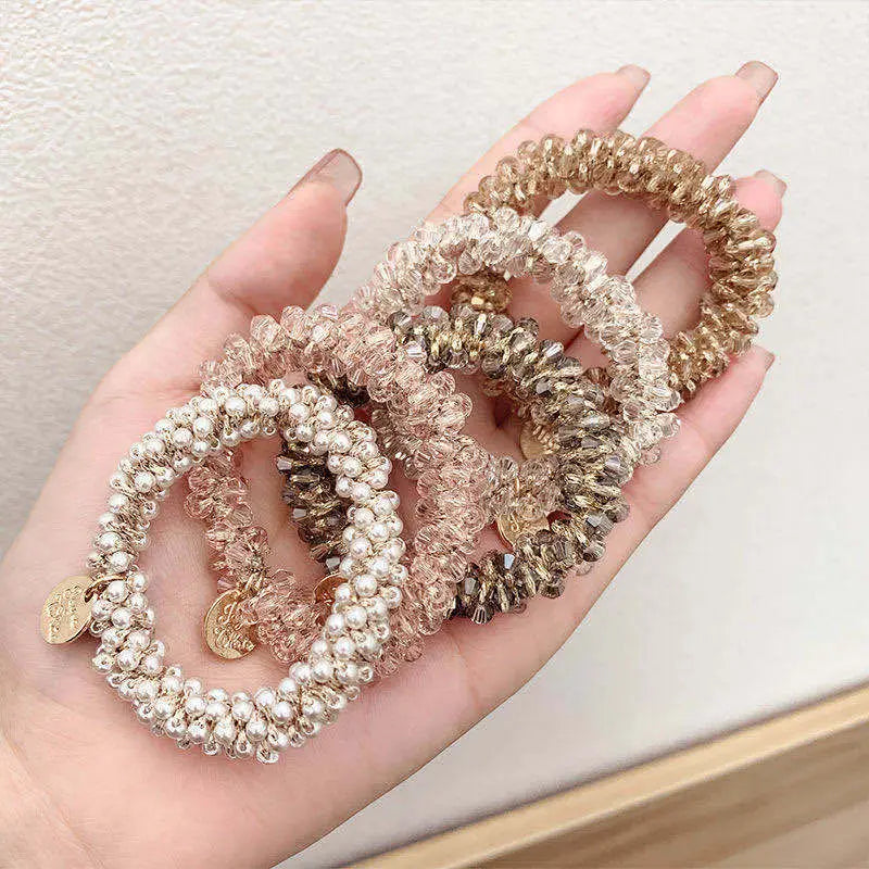 LuxeBraid Crystal Elegance: Handmade Pearl & Crystal Elastic Hair Rope. Hair accessories for brides.. Hair accessories in USA. Bride accessories in USA. Bridal hair accessories in USA. Kids hair accessories in USA. Girls hair accessories. Hair products. Beautiful hair accessories.