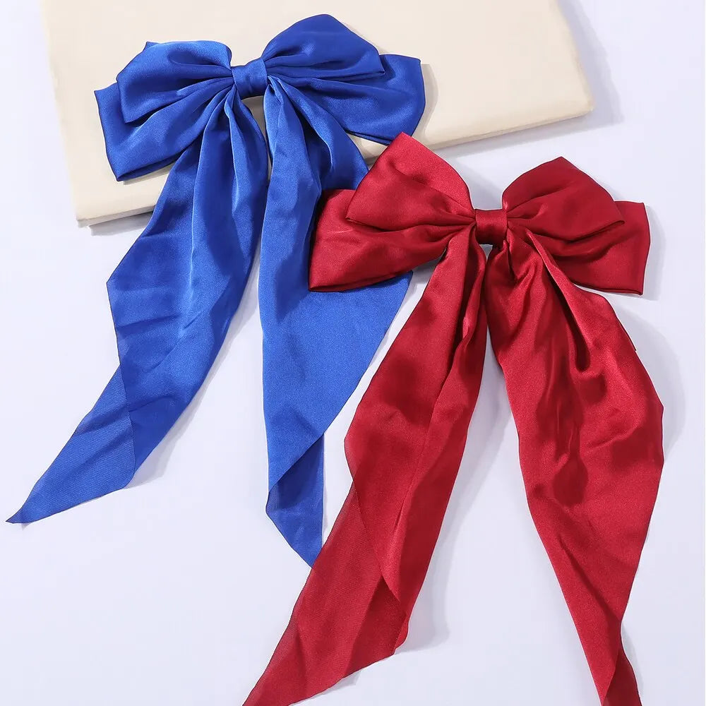 Chic Ribbon Elegance: 2-Piece Satin Bow Hair Clip Set. Hair accessories in USA. Bride accessories in USA. Bridal hair accessories in USA. Kids hair accessories in USA. Girls hair accessories. Hair products. Beautiful hair accessories.