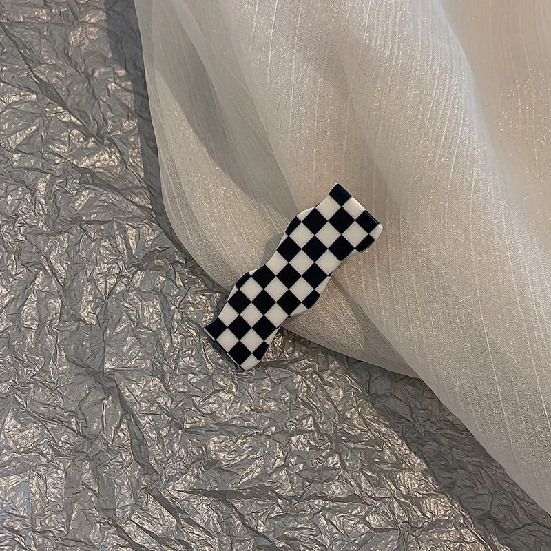 Monochrome Elegance: Retro Grid Acrylic Side Clip. Hair accessories for brides. Hair accessories in USA. Bride accessories in USA. Bridal hair accessories in USA. Kids hair accessories in USA. Girls hair accessories. Hair products. Beautiful hair accessories.