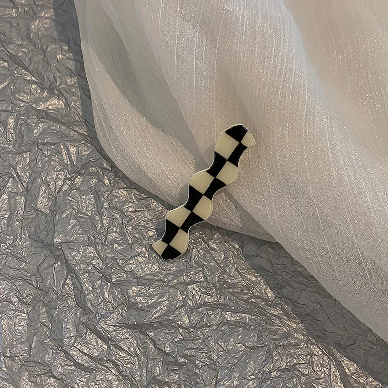 Monochrome Elegance: Retro Grid Acrylic Side Clip. Hair accessories for brides. Hair accessories in USA. Bride accessories in USA. Bridal hair accessories in USA. Kids hair accessories in USA. Girls hair accessories. Hair products. Beautiful hair accessories.