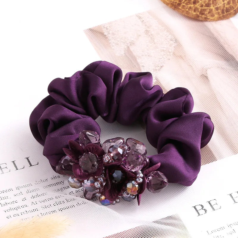 Dazzling Petal Elegance: Crystal-Embellished Floral Fabric Scrunchies. Hair accessories for brides.. Hair accessories in USA. Bride accessories in USA. Bridal hair accessories in USA. Kids hair accessories in USA. Girls hair accessories. Hair products. Beautiful hair accessories.