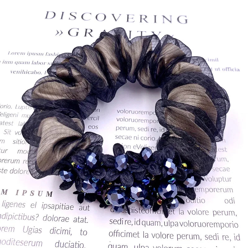 Dazzling Petal Elegance: Crystal-Embellished Floral Fabric Scrunchies. Hair accessories for brides.. Hair accessories in USA. Bride accessories in USA. Bridal hair accessories in USA. Kids hair accessories in USA. Girls hair accessories. Hair products. Beautiful hair accessories.