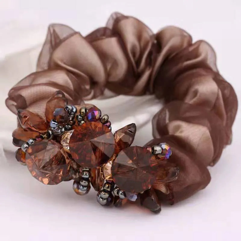 Dazzling Petal Elegance: Crystal-Embellished Floral Fabric Scrunchies. Hair accessories for brides.. Hair accessories in USA. Bride accessories in USA. Bridal hair accessories in USA. Kids hair accessories in USA. Girls hair accessories. Hair products. Beautiful hair accessories.