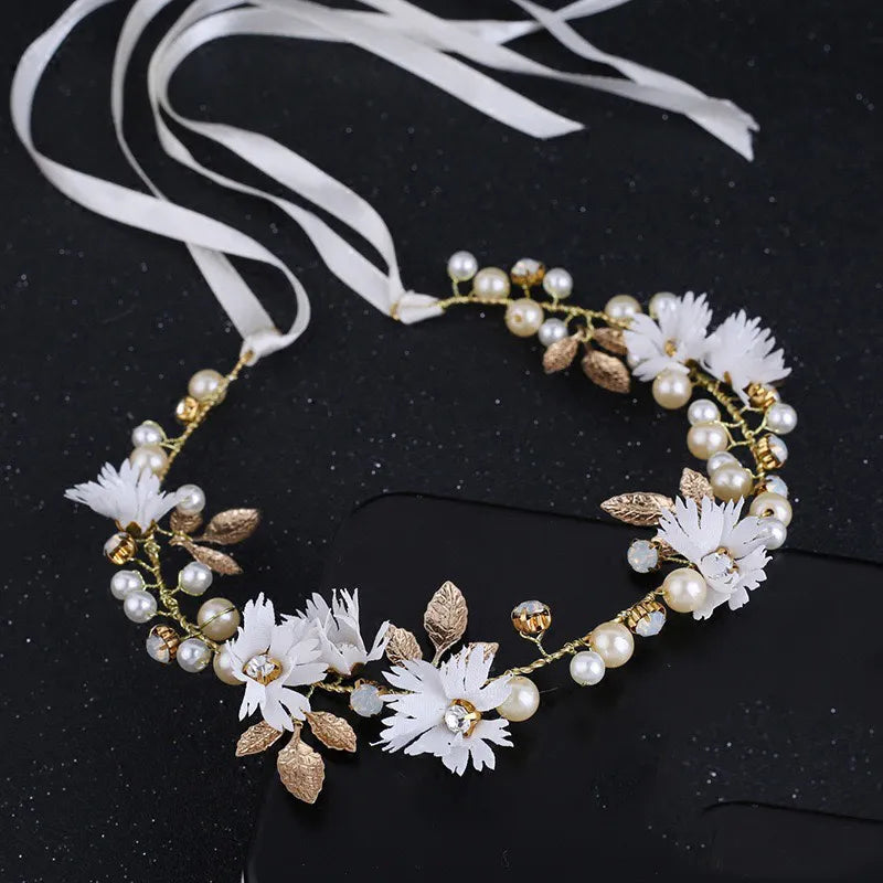 Pearl Petal Radiance: Elegant Floral Bridal Headband. Hairxza Hair Accessories. Hair accessories in USA. Bride accessories in USA. Bridal hair accessories in USA. Kids hair accessories in USA. Girls hair accessories. Hair products. Beautiful hair accessories