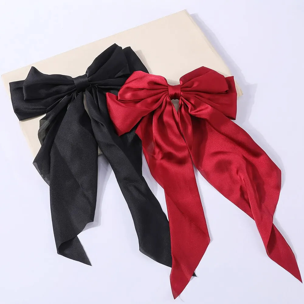 Chic Ribbon Elegance: 2-Piece Satin Bow Hair Clip Set. Hair accessories in USA. Bride accessories in USA. Bridal hair accessories in USA. Kids hair accessories in USA. Girls hair accessories. Hair products. Beautiful hair accessories.