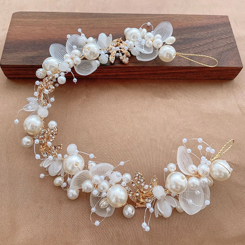 Pearl Petal Radiance: Elegant Floral Bridal Headband. Hairxza Hair Accessories. Hair accessories in USA. Bride accessories in USA. Bridal hair accessories in USA. Kids hair accessories in USA. Girls hair accessories. Hair products. Beautiful hair accessories