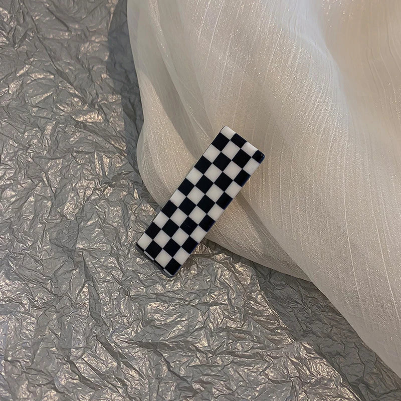 Monochrome Elegance: Retro Grid Acrylic Side Clip. Hair accessories for brides. Hair accessories in USA. Bride accessories in USA. Bridal hair accessories in USA. Kids hair accessories in USA. Girls hair accessories. Hair products. Beautiful hair accessories.