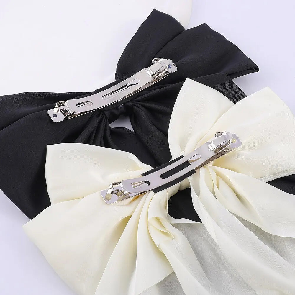 Chic Ribbon Elegance: 2-Piece Satin Bow Hair Clip Set. Hair accessories in USA. Bride accessories in USA. Bridal hair accessories in USA. Kids hair accessories in USA. Girls hair accessories. Hair products. Beautiful hair accessories.