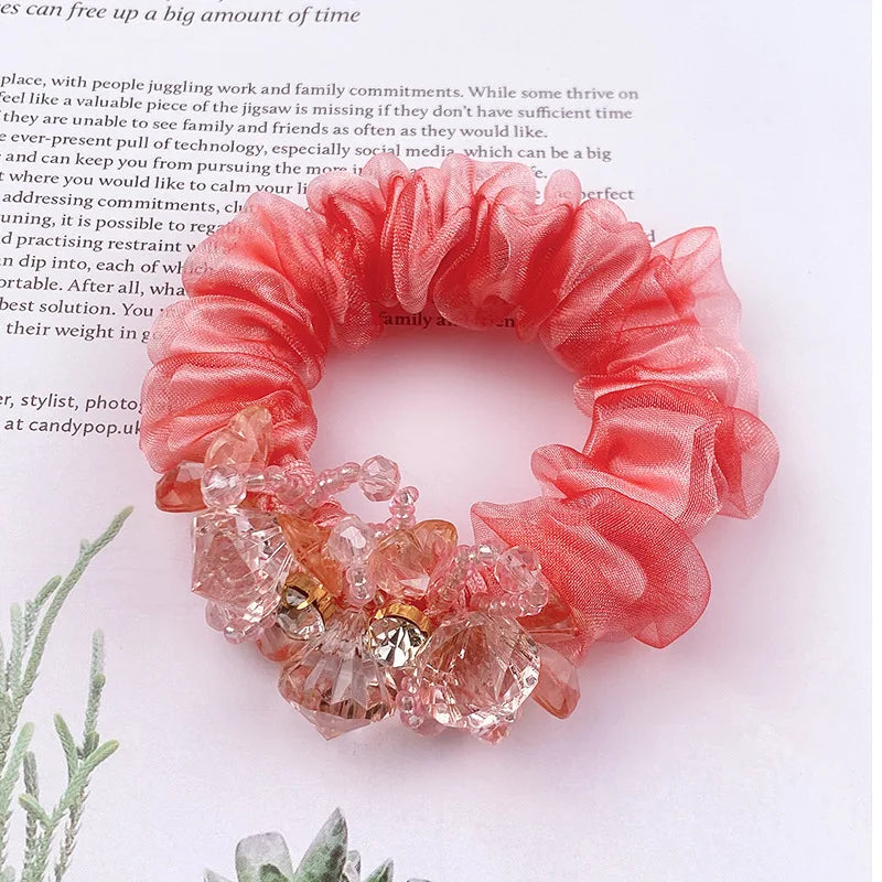 Dazzling Petal Elegance: Crystal-Embellished Floral Fabric Scrunchies. Hair accessories for brides.. Hair accessories in USA. Bride accessories in USA. Bridal hair accessories in USA. Kids hair accessories in USA. Girls hair accessories. Hair products. Beautiful hair accessories.