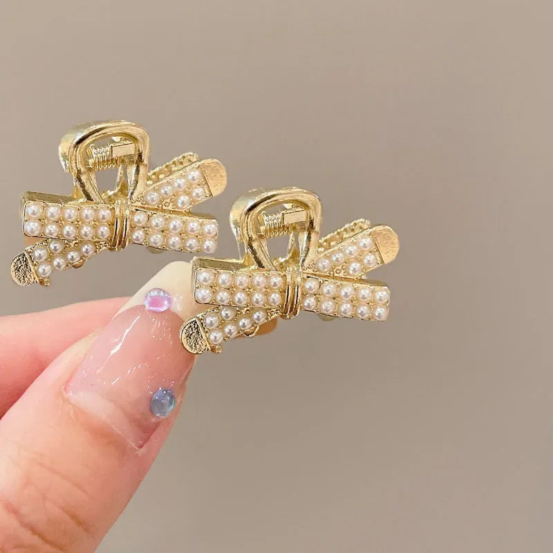 PearlRadiance Duo: Metal Elegance Hair Clips. Hairxza Hair Accessories. Hair accessories in USA. Bride accessories in USA. Bridal hair accessories in USA. Kids hair accessories in USA. Girls hair accessories. Hair products. Beautiful hair accessories.