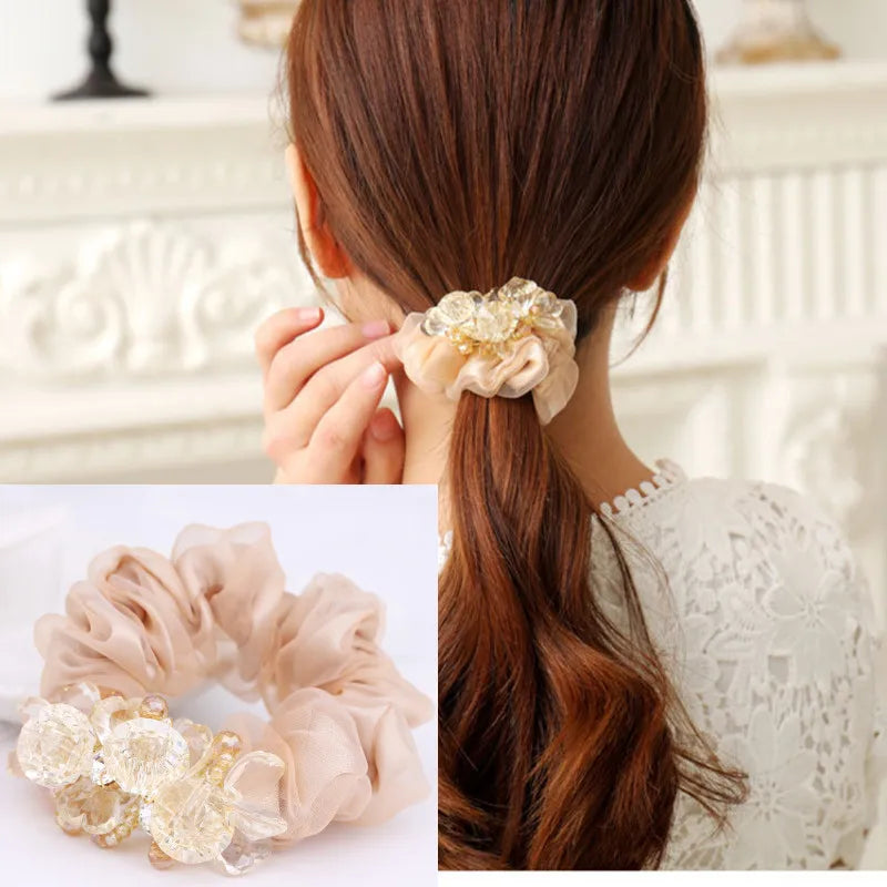 Dazzling Petal Elegance: Crystal-Embellished Floral Fabric Scrunchies. Hair accessories for brides.. Hair accessories in USA. Bride accessories in USA. Bridal hair accessories in USA. Kids hair accessories in USA. Girls hair accessories. Hair products. Beautiful hair accessories.