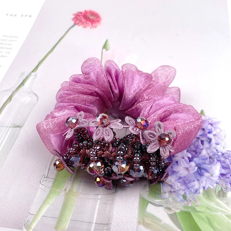 Dazzling Petal Elegance: Crystal-Embellished Floral Fabric Scrunchies. Hair accessories for brides.. Hair accessories in USA. Bride accessories in USA. Bridal hair accessories in USA. Kids hair accessories in USA. Girls hair accessories. Hair products. Beautiful hair accessories.