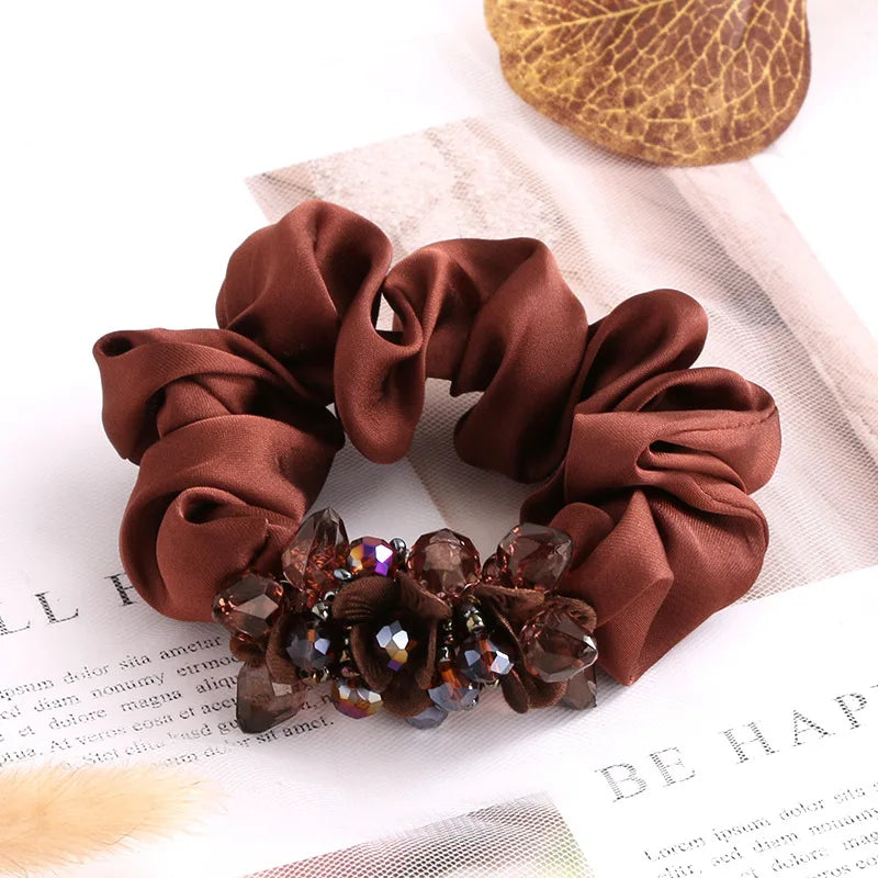 Dazzling Petal Elegance: Crystal-Embellished Floral Fabric Scrunchies. Hair accessories for brides.. Hair accessories in USA. Bride accessories in USA. Bridal hair accessories in USA. Kids hair accessories in USA. Girls hair accessories. Hair products. Beautiful hair accessories.