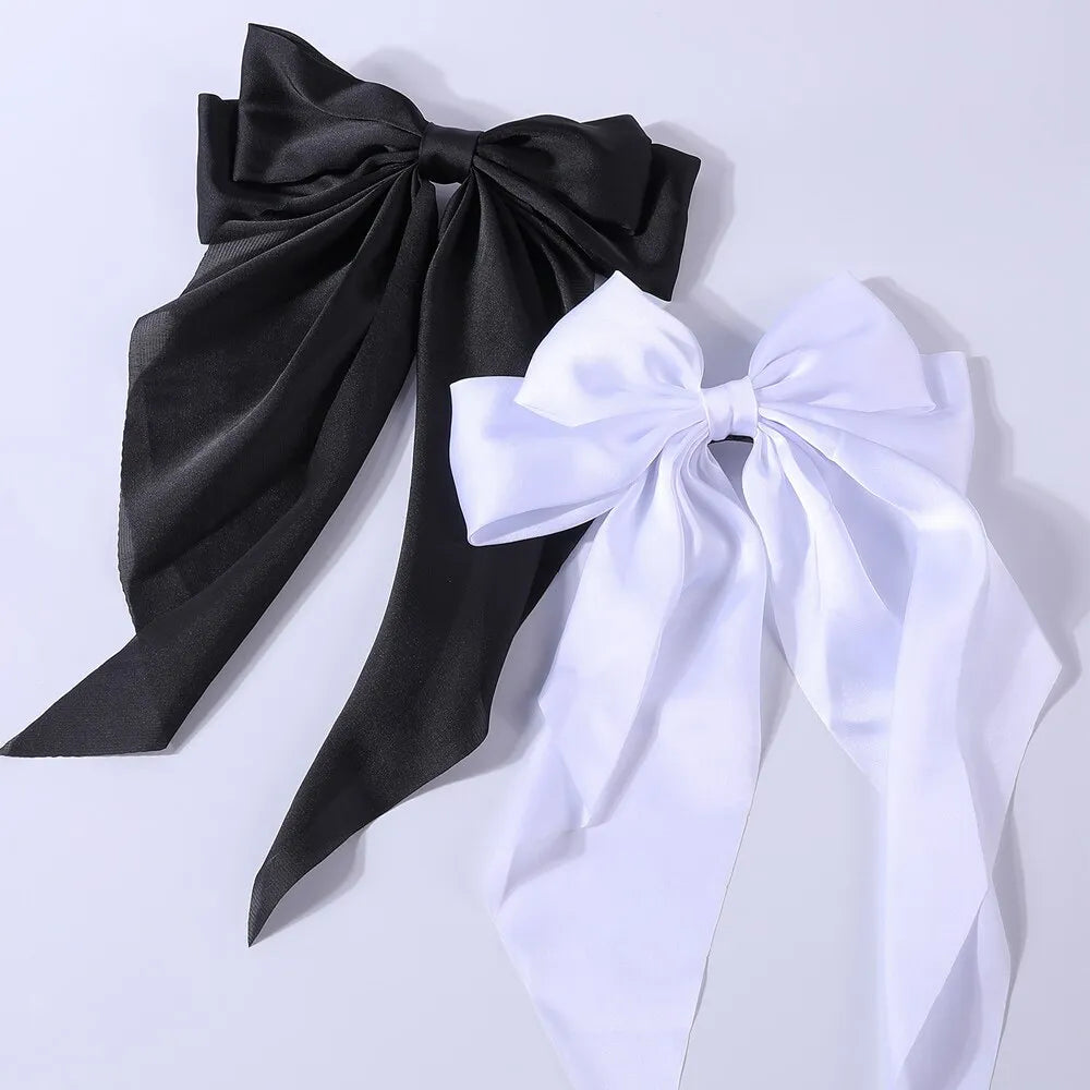 Chic Ribbon Elegance: 2-Piece Satin Bow Hair Clip Set. Hair accessories in USA. Bride accessories in USA. Bridal hair accessories in USA. Kids hair accessories in USA. Girls hair accessories. Hair products. Beautiful hair accessories.