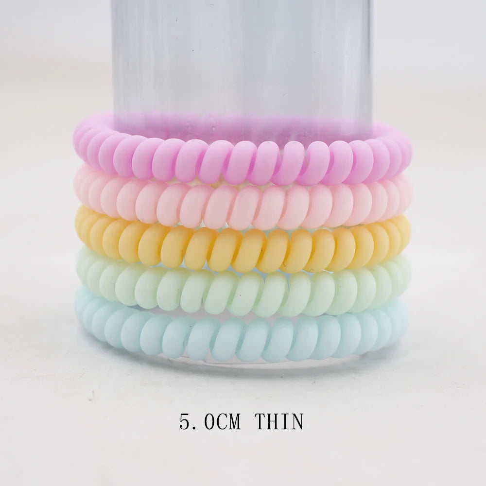 Frost Flex Chic Coil Collection: 5Pcs Matt Solid Telephone Wire Elastic Hair Bands. Hairxza Hair Accessories. Hair accessories in USA. Bride accessories in USA. Bridal hair accessories in USA. Kids hair accessories in USA. Girls hair accessories. Hair products. Beautiful hair accessories.