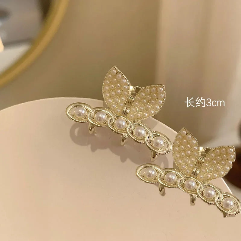 PearlRadiance Duo: Metal Elegance Hair Clips. Hairxza Hair Accessories. Hair accessories in USA. Bride accessories in USA. Bridal hair accessories in USA. Kids hair accessories in USA. Girls hair accessories. Hair products. Beautiful hair accessories.