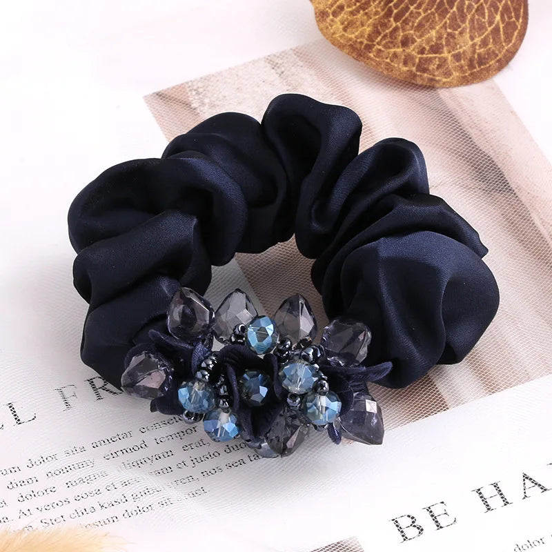 Dazzling Petal Elegance: Crystal-Embellished Floral Fabric Scrunchies. Hair accessories for brides.. Hair accessories in USA. Bride accessories in USA. Bridal hair accessories in USA. Kids hair accessories in USA. Girls hair accessories. Hair products. Beautiful hair accessories.