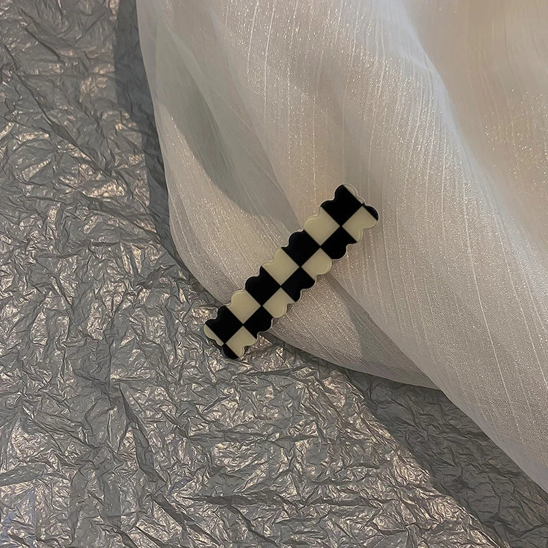 Monochrome Elegance: Retro Grid Acrylic Side Clip. Hair accessories for brides. Hair accessories in USA. Bride accessories in USA. Bridal hair accessories in USA. Kids hair accessories in USA. Girls hair accessories. Hair products. Beautiful hair accessories.