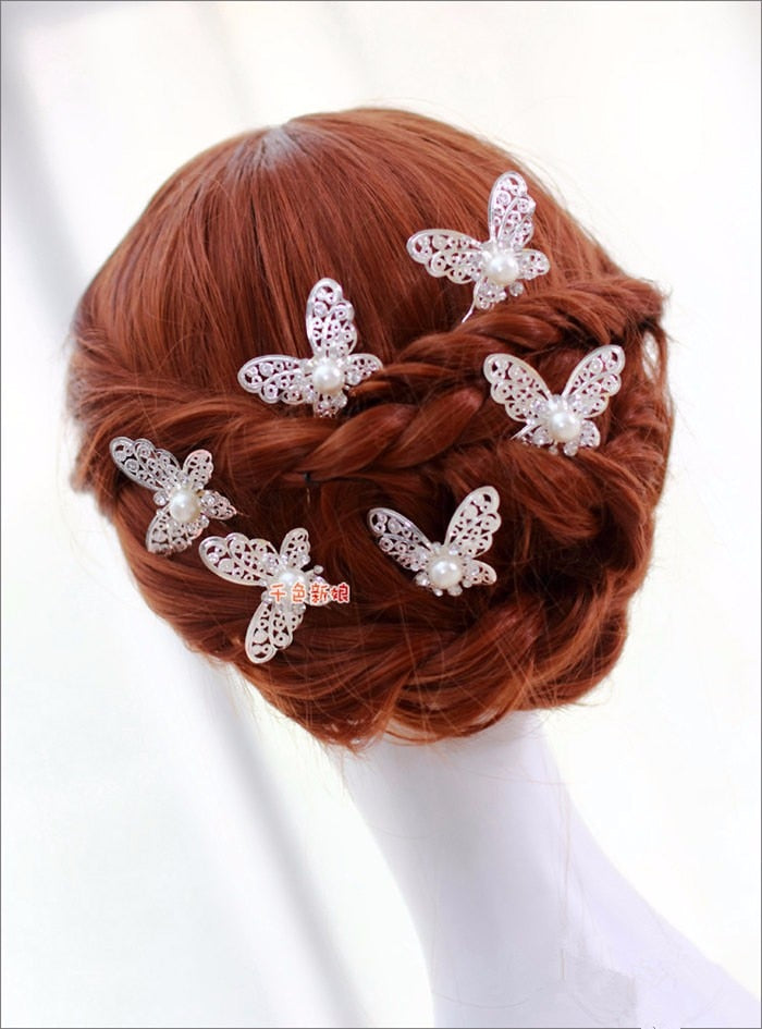 Radiant Pearl Butterfly Hairpins. Bridal Wedding hair accessory. Bridal hair Accessory. Wedding bridal hair combs. Hair accessories for brides. Hair accessories in USA. Bride accessories in USA. Bridal hair accessories in USA. Kids hair accessories in USA. Girls hair accessories. Hair products. Beautiful hair accessories.