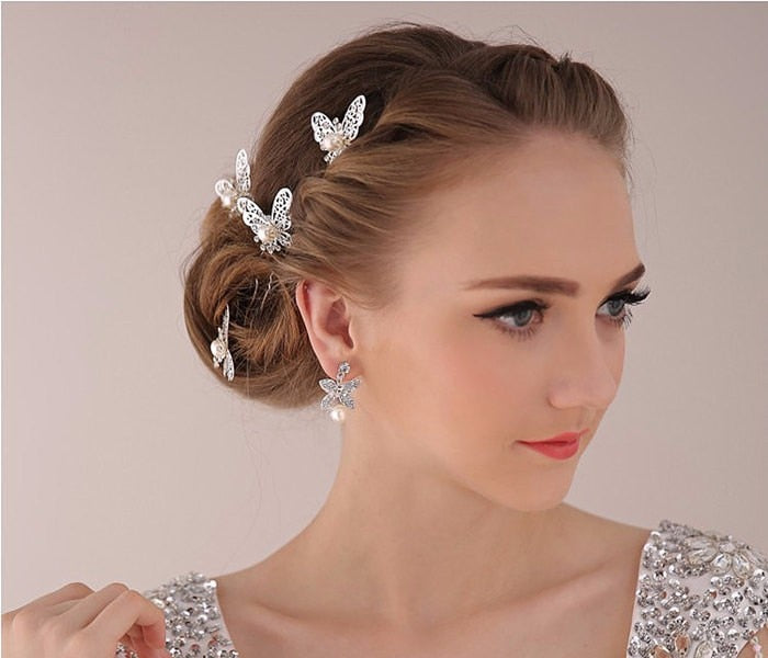 Radiant Pearl Butterfly Hairpins. Bridal Wedding hair accessory. Bridal hair Accessory. Wedding bridal hair combs. Hair accessories for brides. Hair accessories in USA. Bride accessories in USA. Bridal hair accessories in USA. Kids hair accessories in USA. Girls hair accessories. Hair products. Beautiful hair accessories.