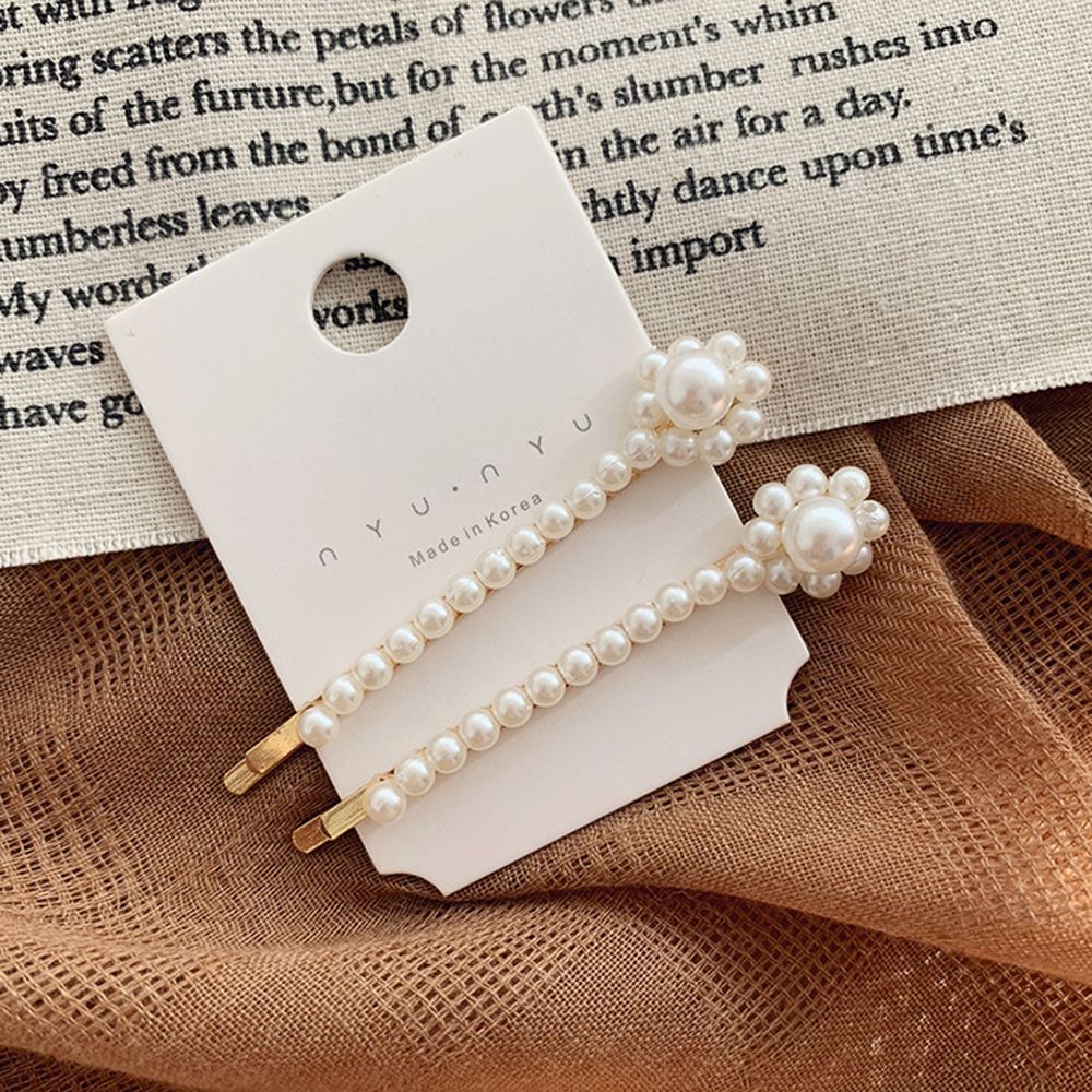 Pearl Adorn Hair Clips. Hair accessory. Hairxza Hair Accessories. Hair accessories in USA. Bride accessories in USA. Bridal hair accessories in USA. Kids hair accessories in USA. Girls hair accessories. Hair products. Beautiful hair accessories.