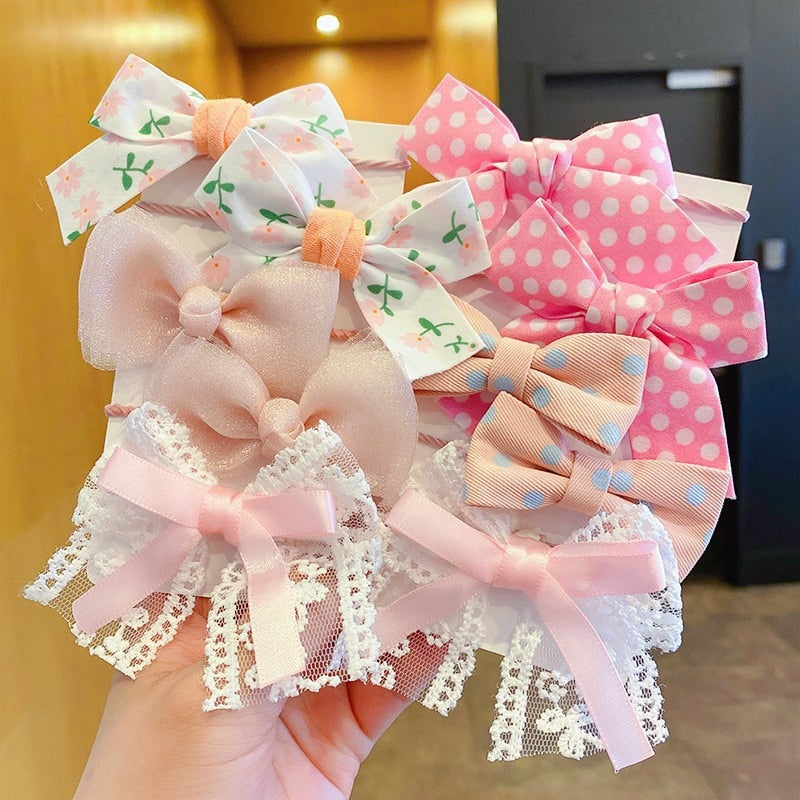 Bow Bloom Hairties. Girls Hair ties.Hair accessories for brides.. Hair accessories in USA. Bride accessories in USA. Bridal hair accessories in USA. Kids hair accessories in USA. Girls hair accessories. Hair products. Beautiful hair accessories.