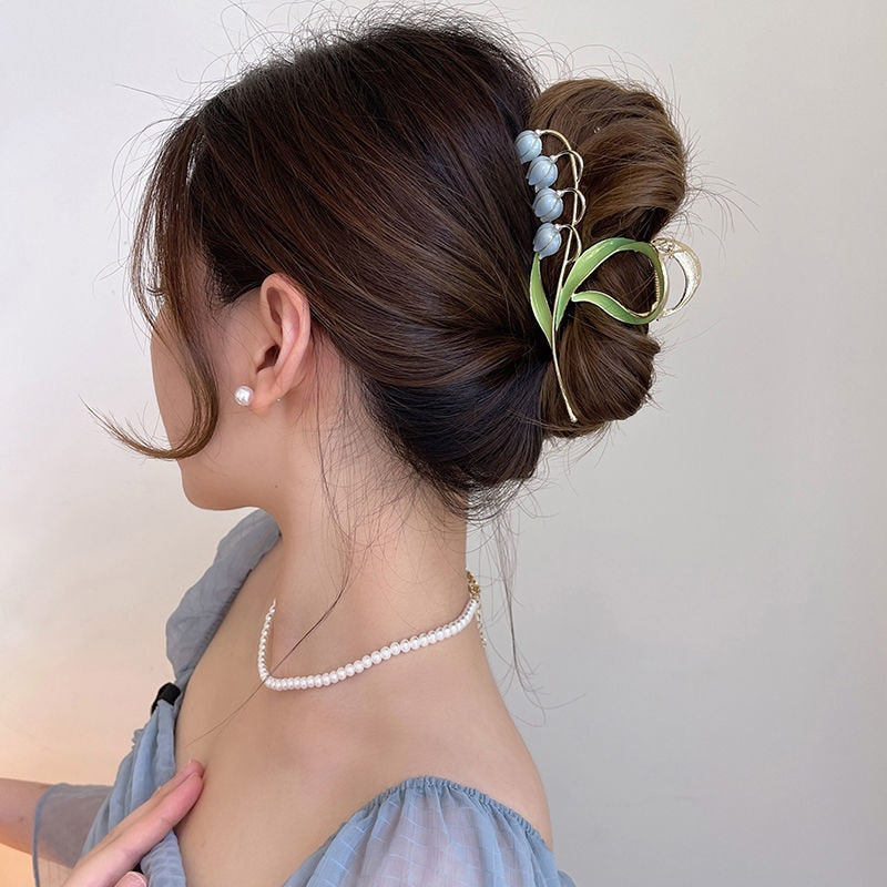 Orchid Flower Hair Clip. Elegant beautiful flower hair clips. Flower Hair accessory. Hair accessories for brides. Hair accessories in USA. Bride accessories in USA. Bridal hair accessories in USA. Kids hair accessories in USA. Girls hair accessories. Hair products. Beautiful hair accessories.