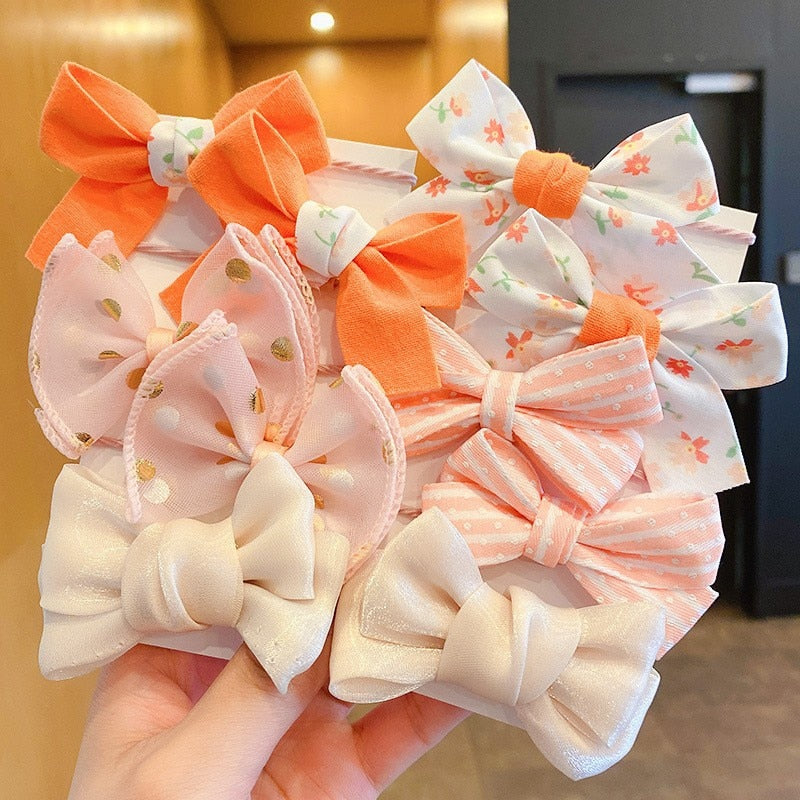 Bow Bloom Hairties. Girls Hair ties.Hair accessories for brides.. Hair accessories in USA. Bride accessories in USA. Bridal hair accessories in USA. Kids hair accessories in USA. Girls hair accessories. Hair products. Beautiful hair accessories.