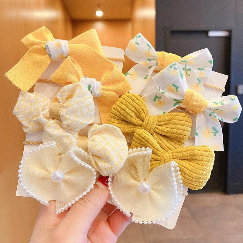 Bow Bloom Hairties. Girls Hair ties.Hair accessories for brides.. Hair accessories in USA. Bride accessories in USA. Bridal hair accessories in USA. Kids hair accessories in USA. Girls hair accessories. Hair products. Beautiful hair accessories.