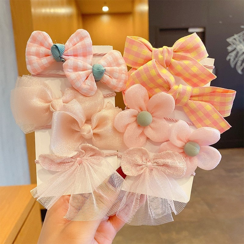 Bow Bloom Hairties. Girls Hair ties.Hair accessories for brides.. Hair accessories in USA. Bride accessories in USA. Bridal hair accessories in USA. Kids hair accessories in USA. Girls hair accessories. Hair products. Beautiful hair accessories.