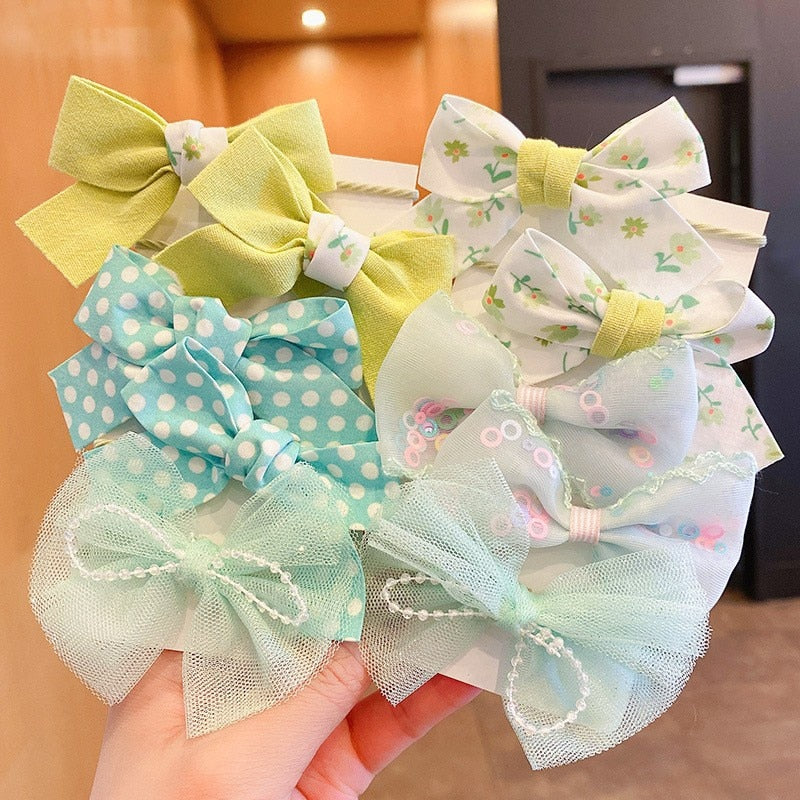 Bow Bloom Hairties. Girls Hair ties.Hair accessories for brides.. Hair accessories in USA. Bride accessories in USA. Bridal hair accessories in USA. Kids hair accessories in USA. Girls hair accessories. Hair products. Beautiful hair accessories.