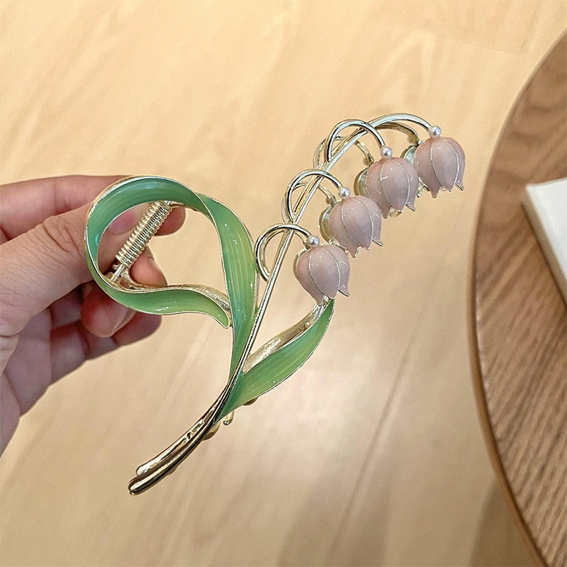 Orchid Flower Hair Clip. Elegant beautiful flower hair clips. Flower Hair accessory. Hair accessories for brides. Hair accessories in USA. Bride accessories in USA. Bridal hair accessories in USA. Kids hair accessories in USA. Girls hair accessories. Hair products. Beautiful hair accessories.